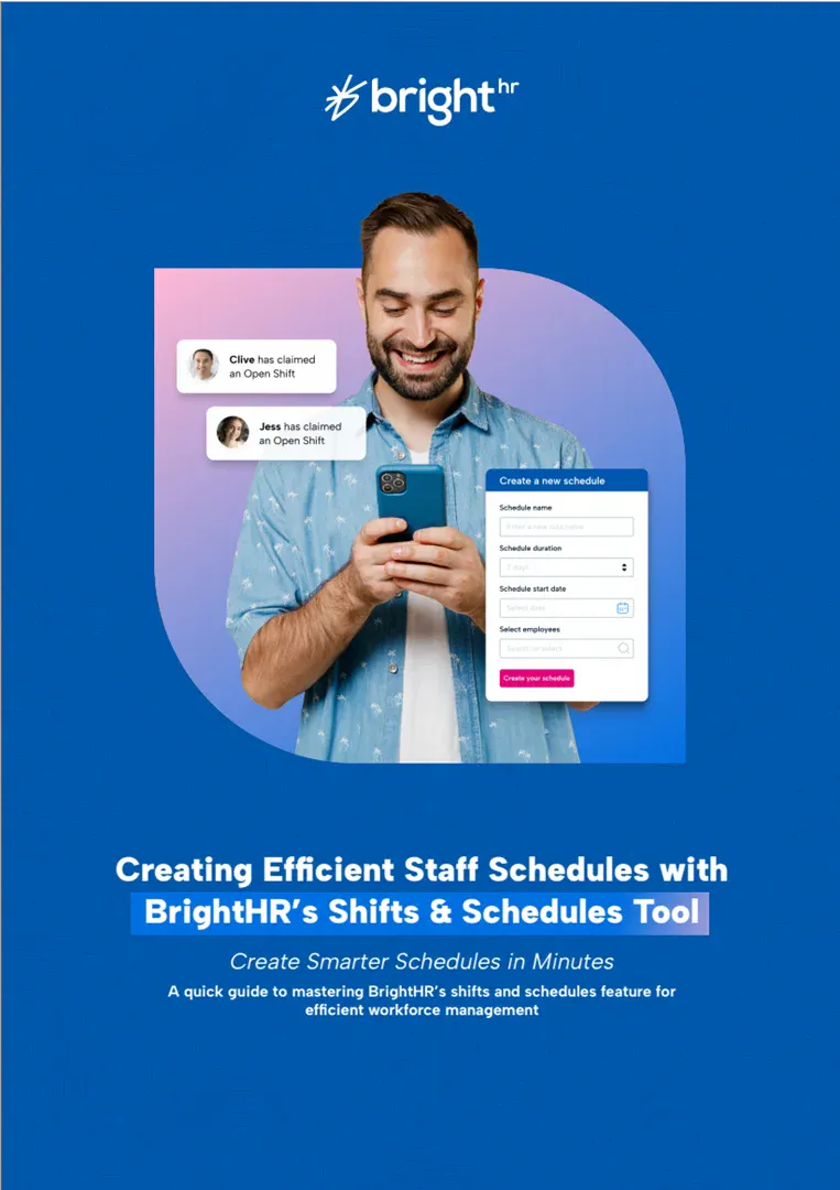 A man smiling at his phone while looking at shift and scheduling software